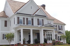 a large home with siding and shingles