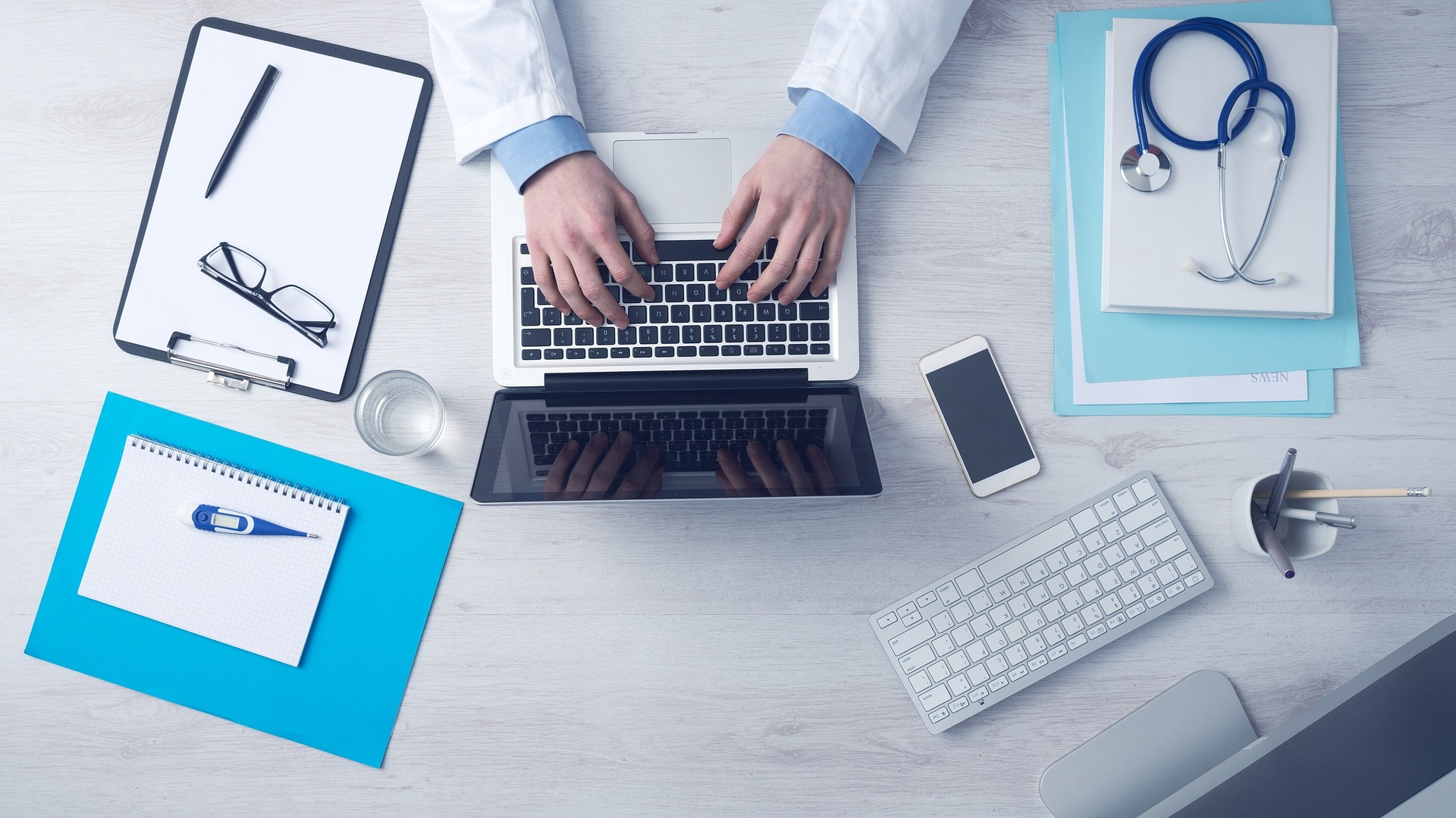 medical professional working on a computer