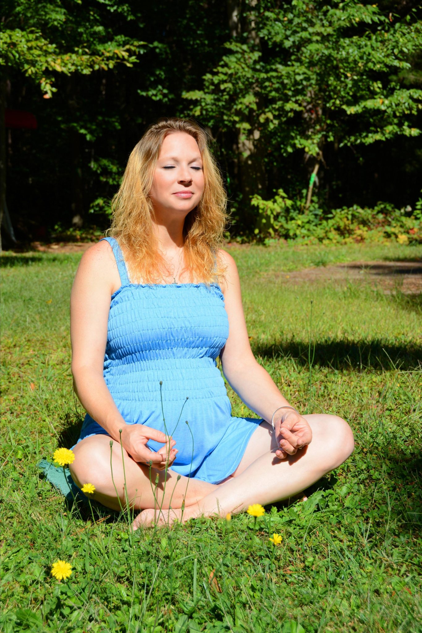 woman doing yoga while pregnant