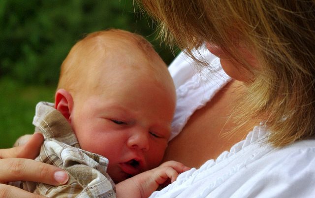 Mother and baby breastfeeding