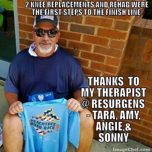 Man holding a peachtree road race shirt with text on the picture expressing his gratitude