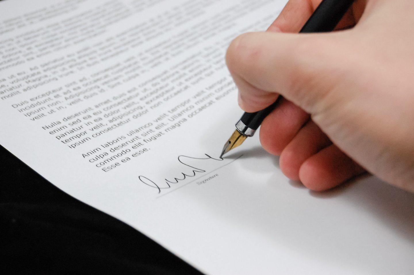 Person signing legal document